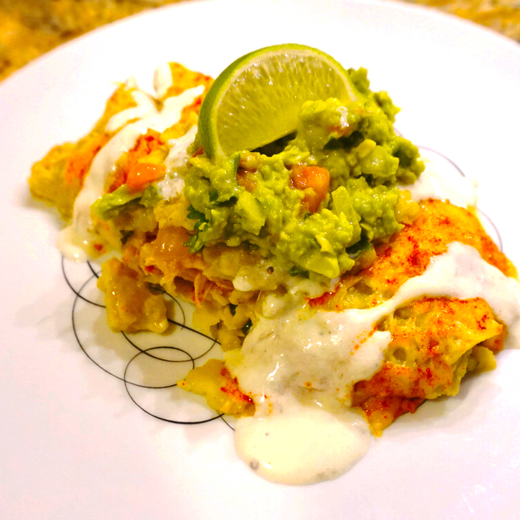 Enchiladas verdes on a white plate