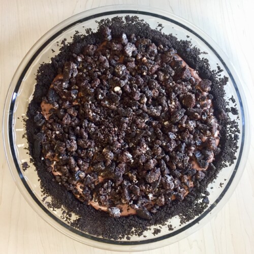 Oreo Pie in a glass pie plate on a wood table