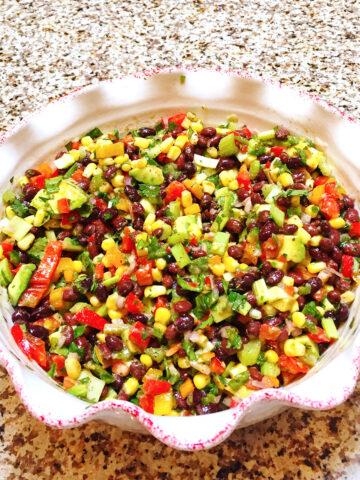 Sweet and spicy black bean salad in a bowl on a counter