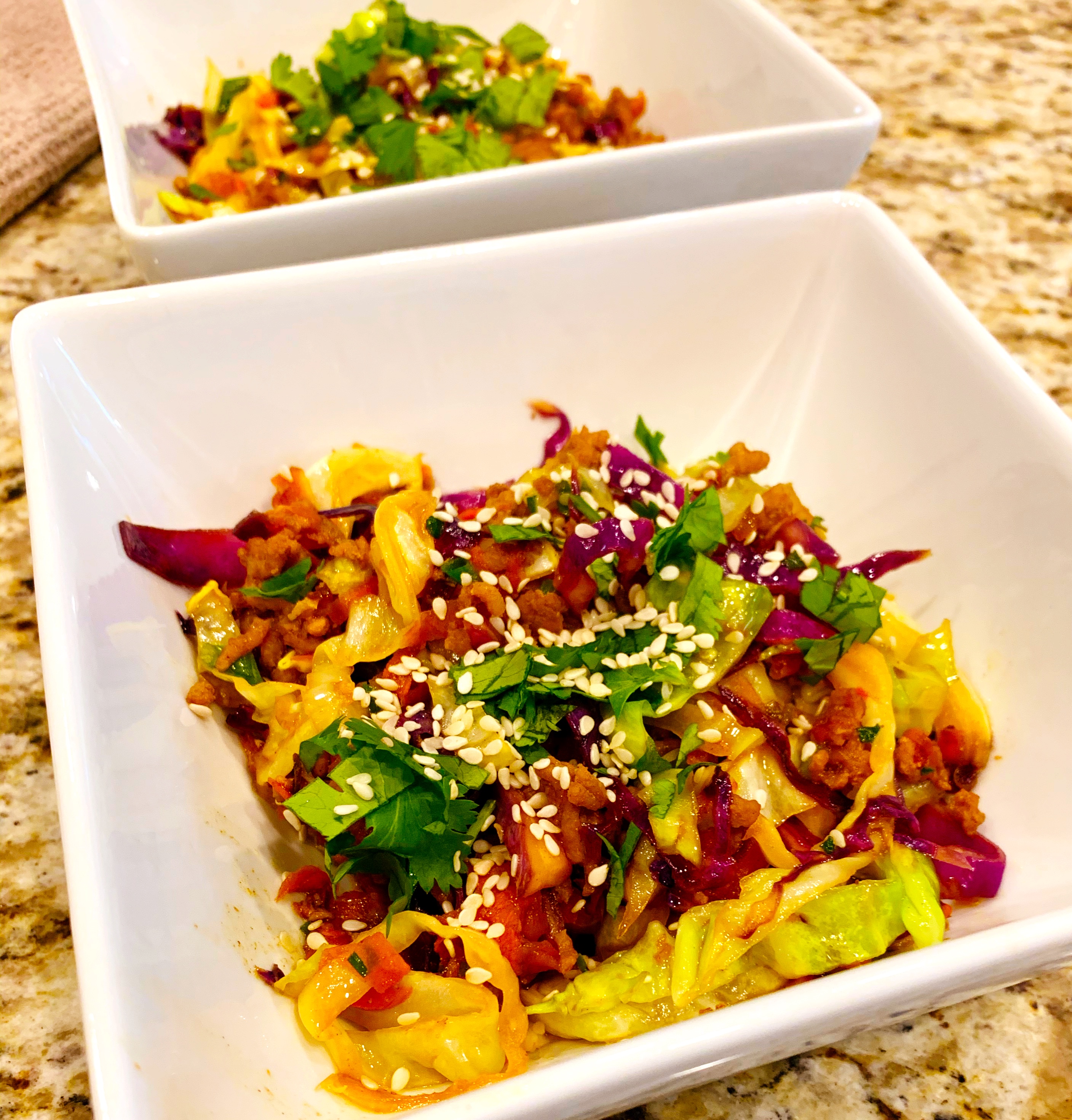 Egg roll in a bowl recipe in a white bowl on a countertop