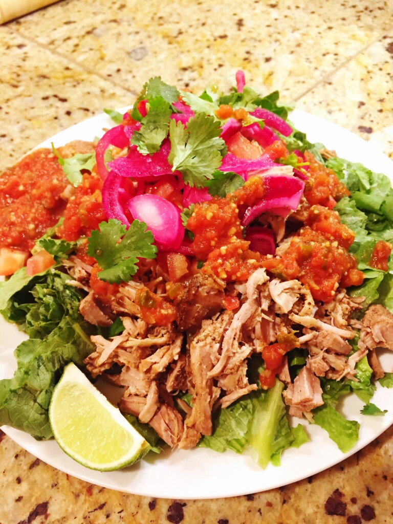 Carnitas salad on a white plate