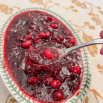 Cranberry sauce in a dish on a table