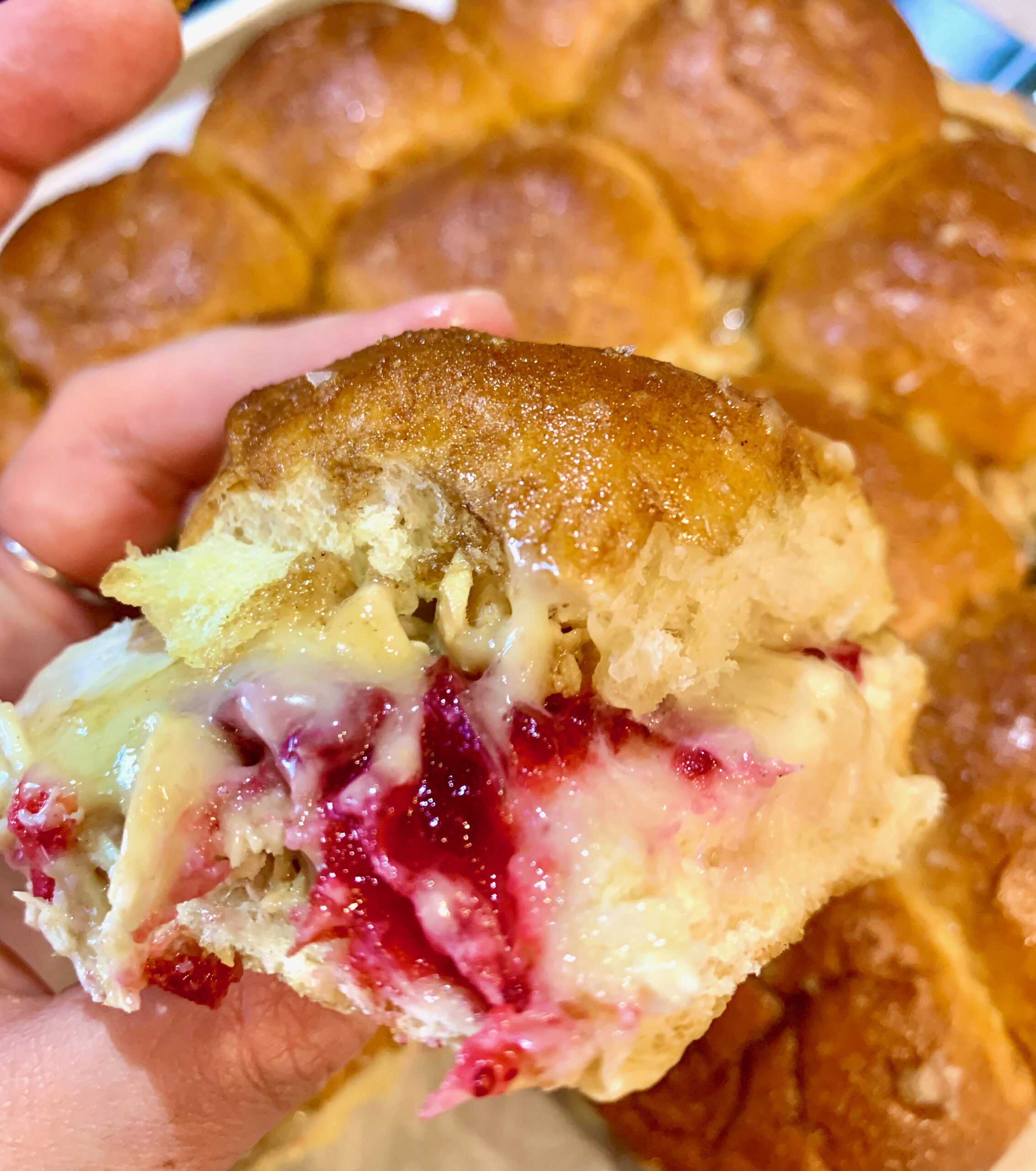 Thanksgiving leftover slider sandwich with a hawaiian roll, brie, turkey and cranberry sauce