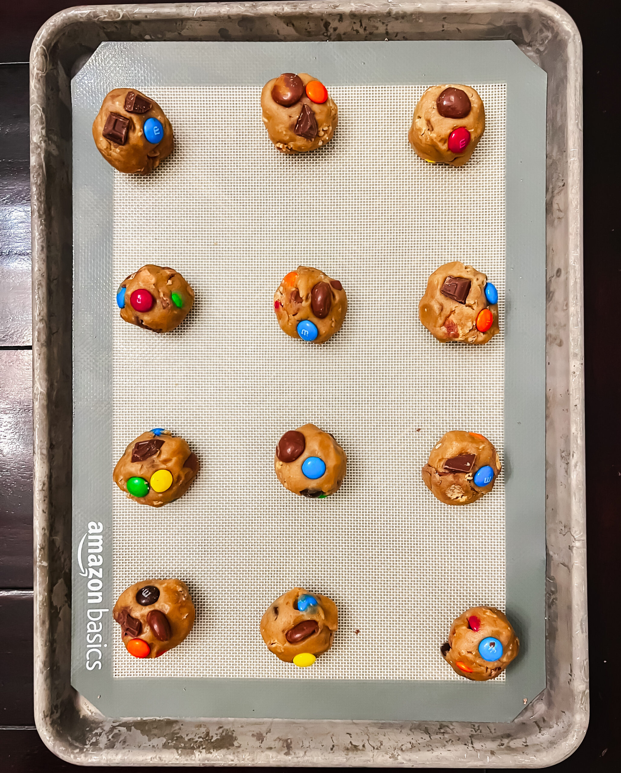 Brown butter leftover Halloween candy cookie dough balls on a sheet pan