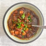 Irish beef stew in a bowl on a white tablecloth