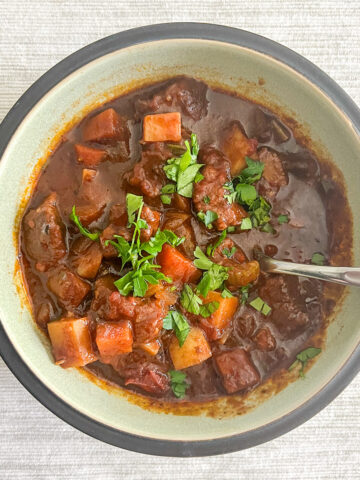 Irish beef stew in a bowl on a white tablecloth