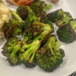 Blasted broccoli on a white plate